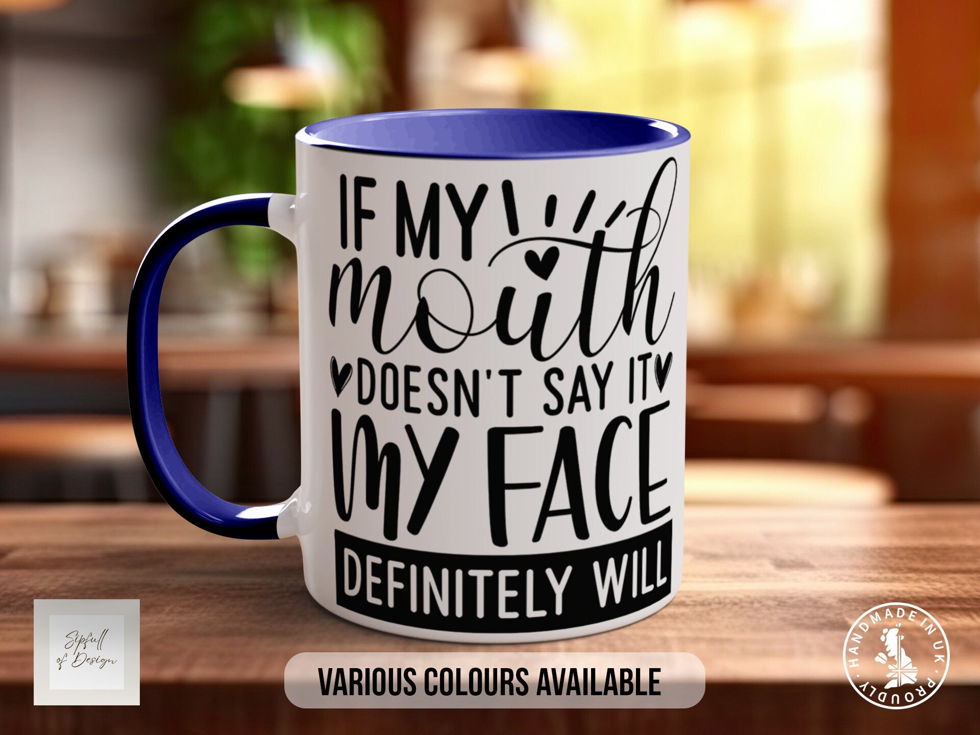 a blue and white coffee mug sitting on top of a wooden table