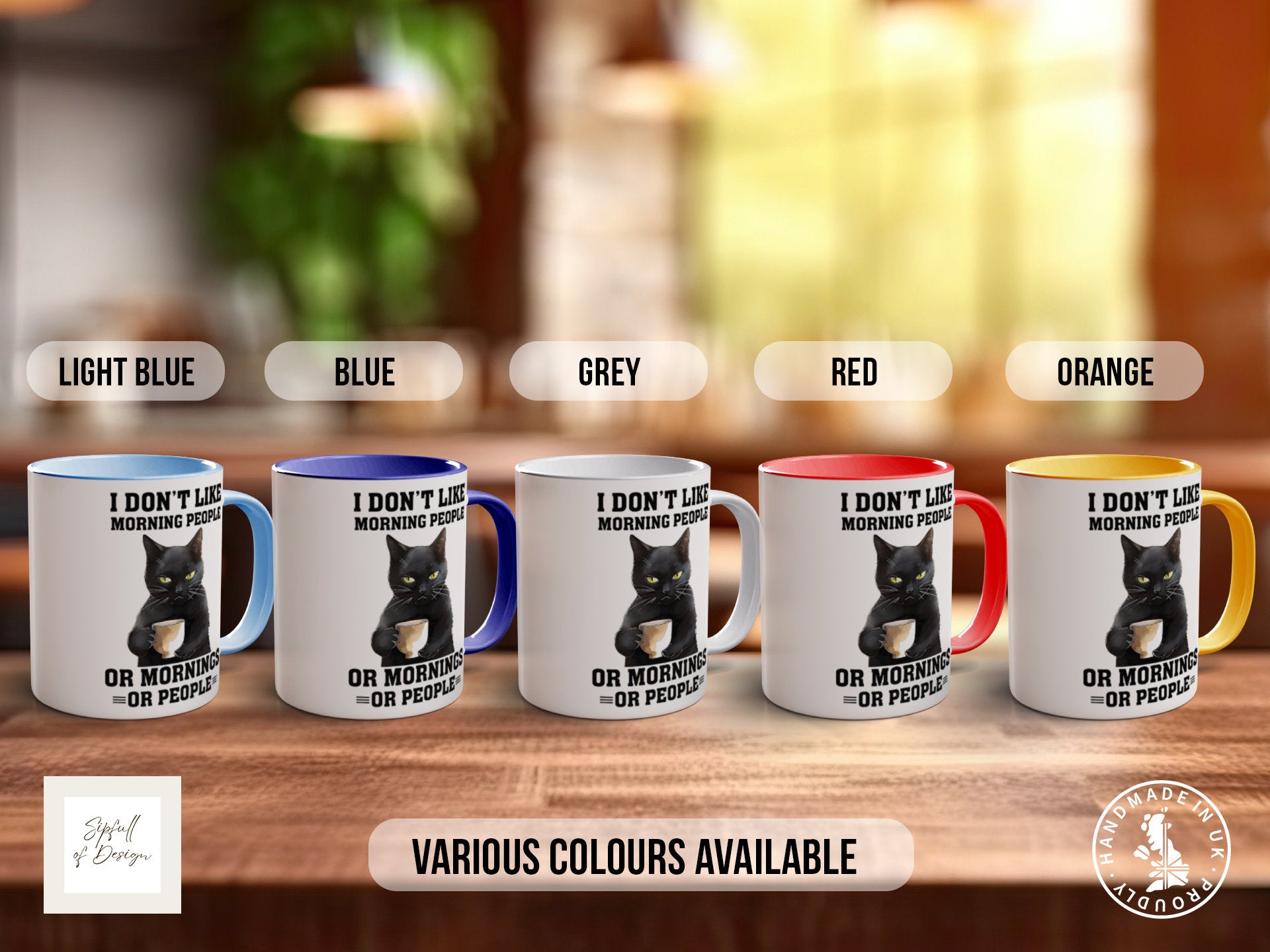 a set of five coffee mugs with a black cat on them