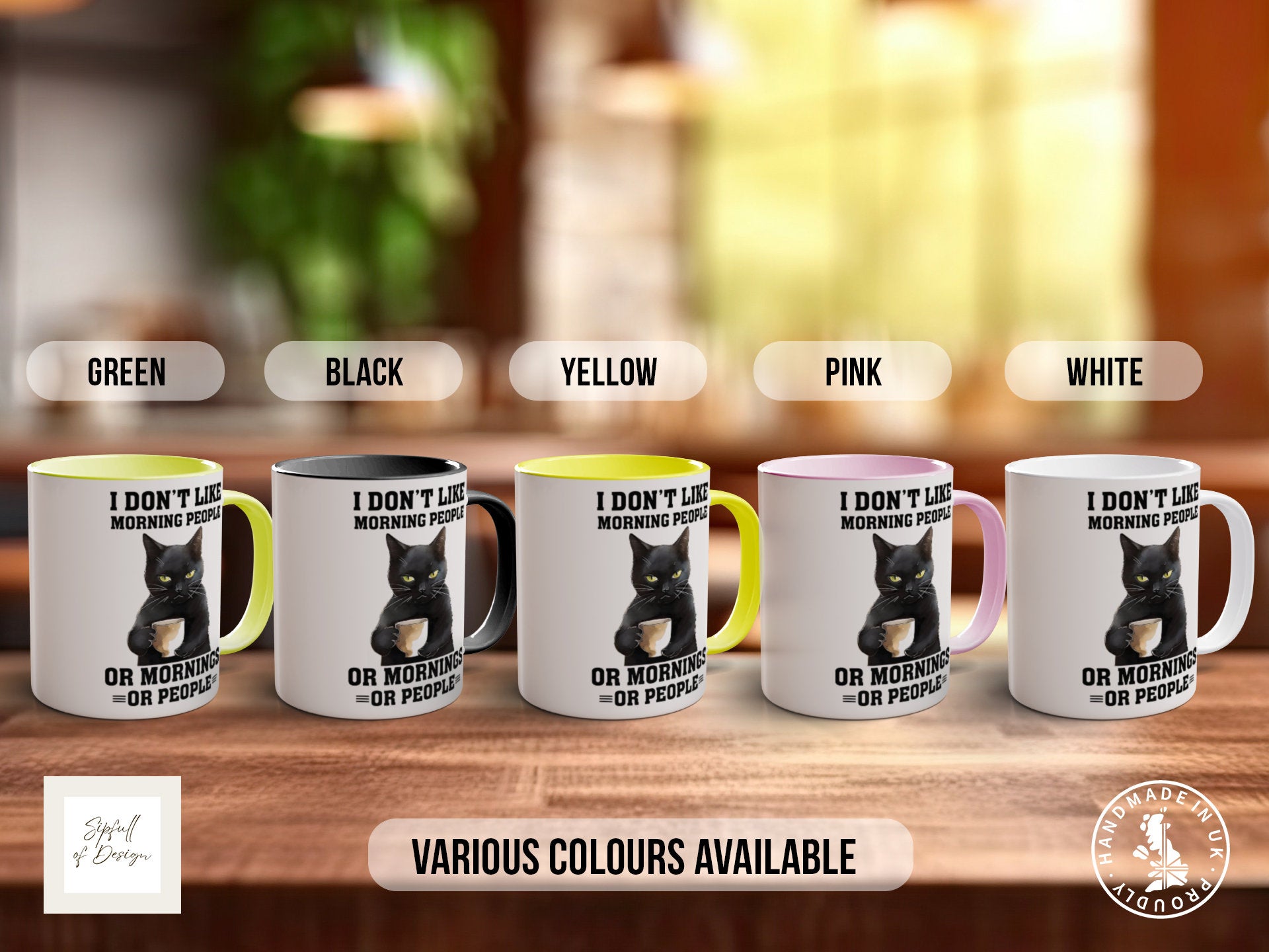 a set of five coffee mugs with a black cat on them