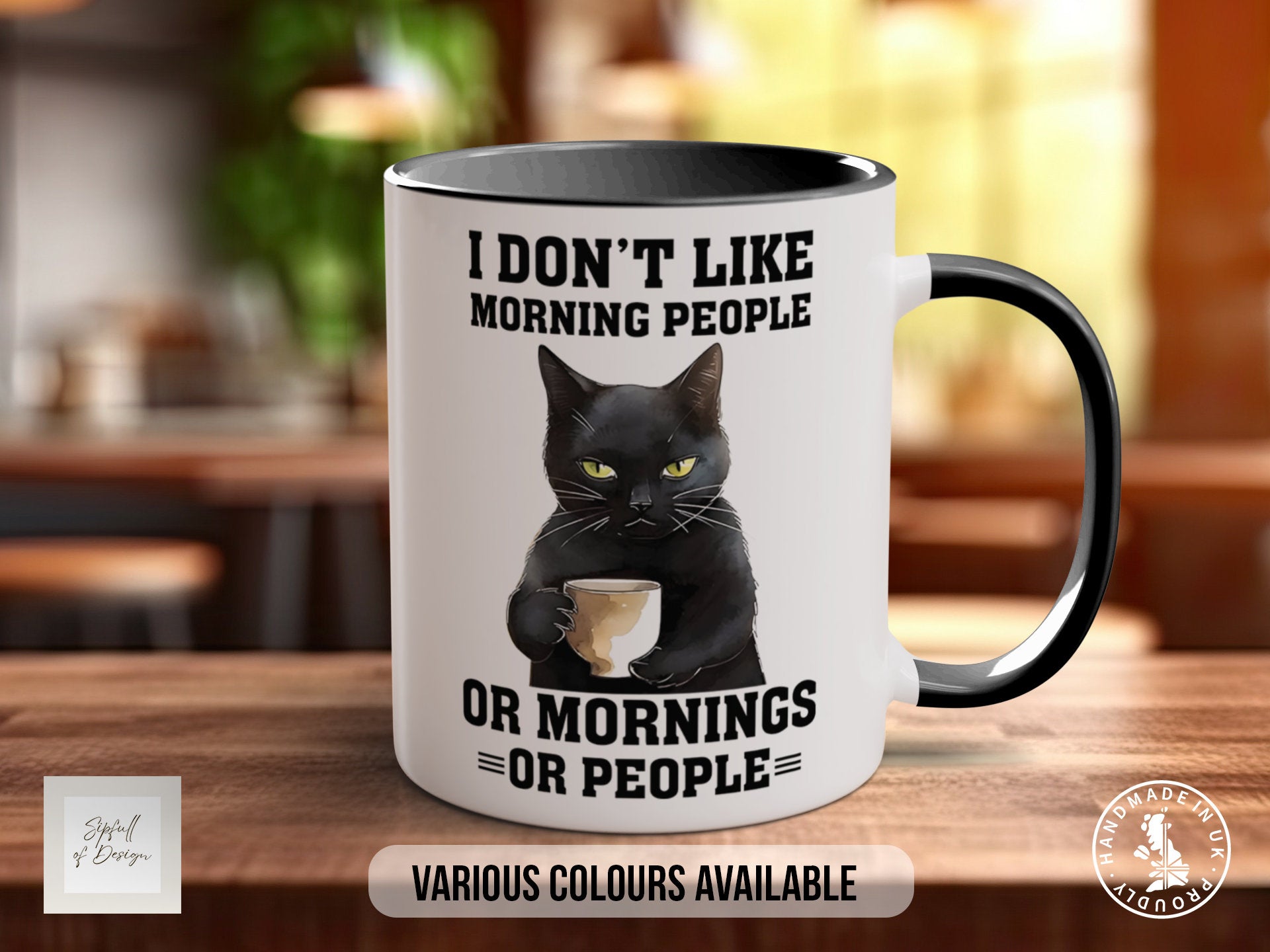 a coffee mug with a black cat holding a cup of coffee